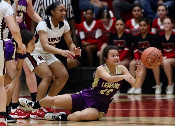 Lemoore's Nyomi Solis passes the ball in Thursday night's West Yosemite League final at Hanford. The Tigers lost but will enter the Central Section playoffs.